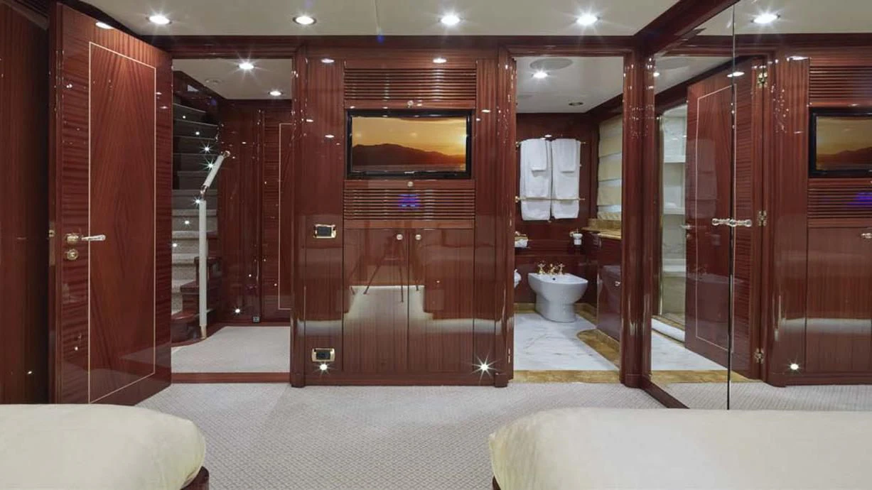 a room with a large mirror and a large wooden closet aboard FORWIN Yacht for Sale