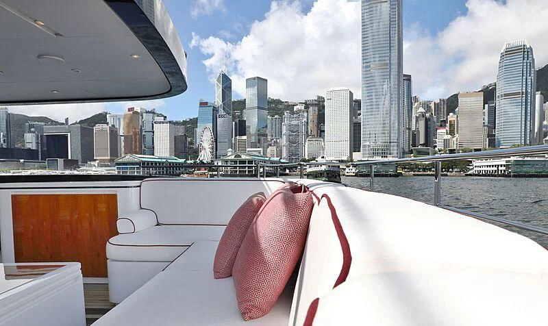 a deck with a view of a city and a river aboard FORWIN Yacht for Sale