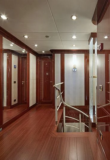 a hallway with a glass door aboard FORWIN Yacht for Sale