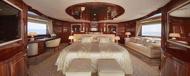 a room with a bed and a couch aboard FORWIN Yacht for Sale