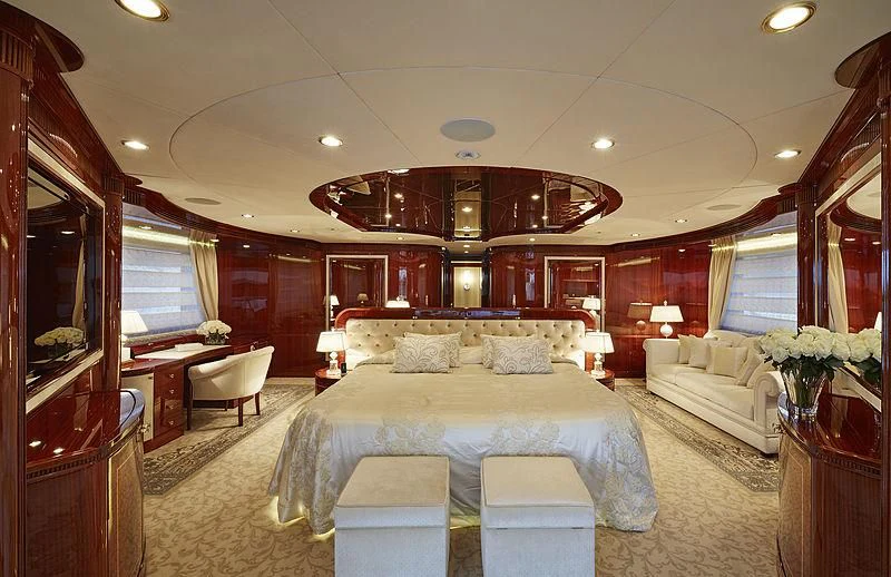 a large bedroom with a bed and a desk aboard FORWIN Yacht for Sale