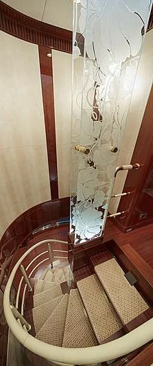 a chair with a patterned rug aboard FORWIN Yacht for Sale