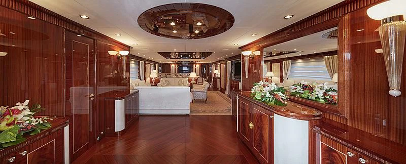 a large room with a large wood floor and a large mirror aboard FORWIN Yacht for Sale