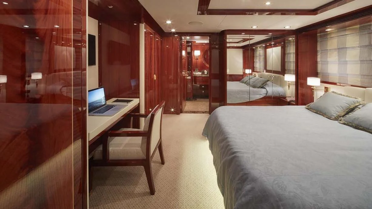 a room with a bed desk and chair aboard FORWIN Yacht for Sale