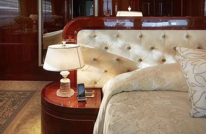 a hotel room with a bed and a phone aboard FORWIN Yacht for Sale