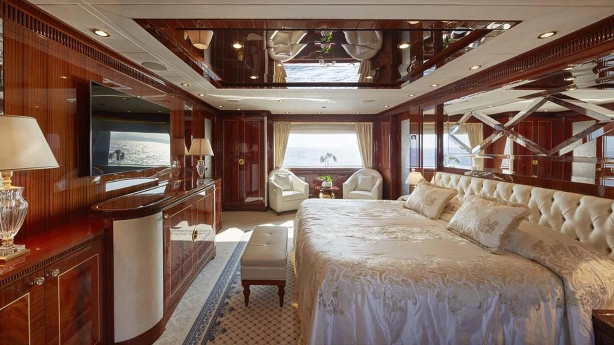 a room with a bed and a desk aboard FORWIN Yacht for Sale