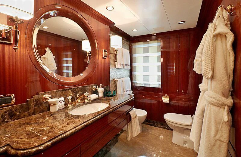 a bathroom with a large mirror aboard FORWIN Yacht for Sale