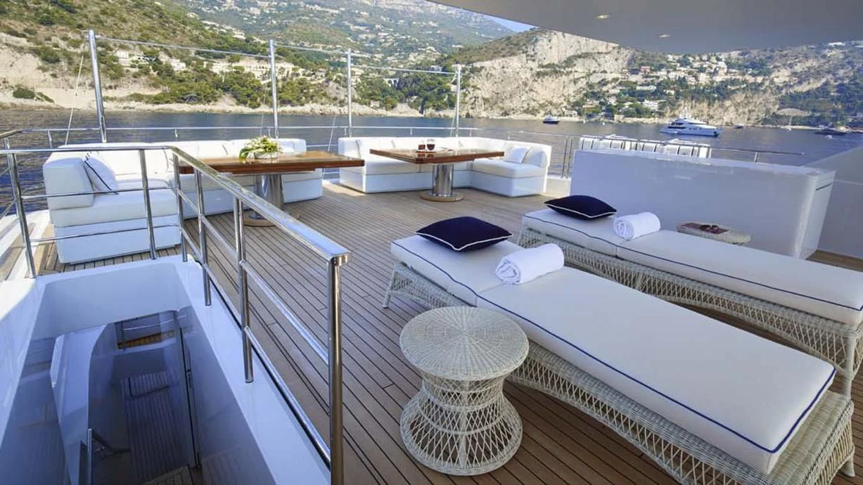 a balcony with a view of a city and a large body of water aboard FORWIN Yacht for Sale