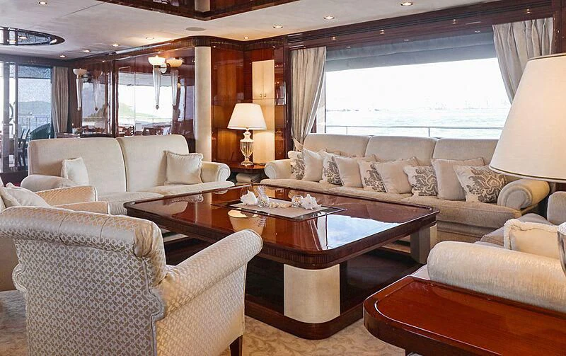 a living room with a couch and a coffee table aboard FORWIN Yacht for Sale
