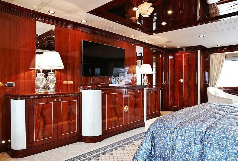 a bedroom with a large mirror aboard FORWIN Yacht for Sale