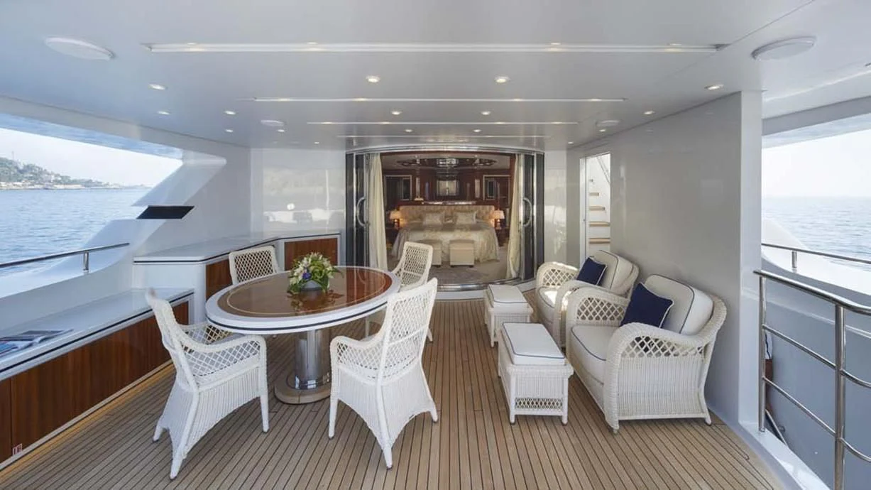 a large living room with a table and chairs aboard FORWIN Yacht for Sale