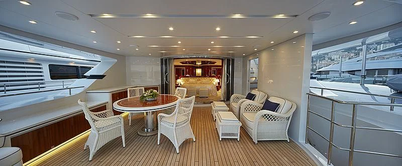 a large living room with a table and chairs aboard FORWIN Yacht for Sale