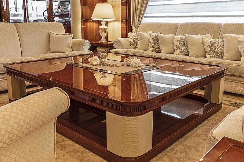 a living room with a coffee table aboard FORWIN Yacht for Sale