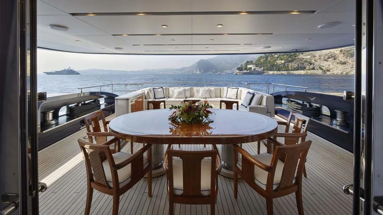 a table with chairs on it aboard FORWIN Yacht for Sale