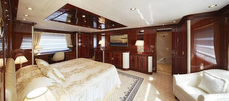 a room with a bed and a television aboard FORWIN Yacht for Sale