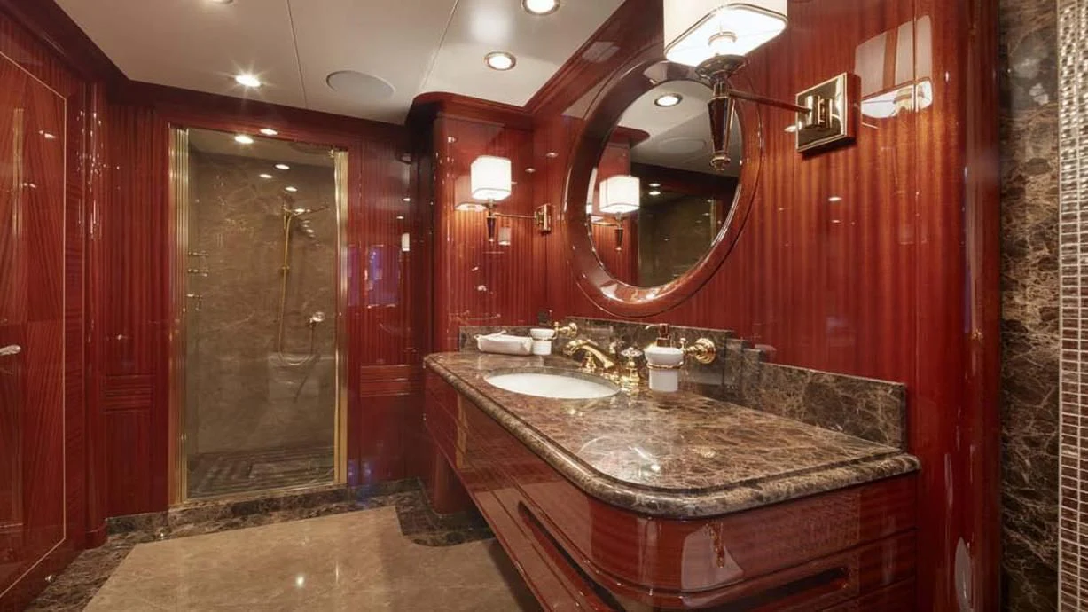 a bathroom with a countertop sink and a mirror aboard FORWIN Yacht for Sale