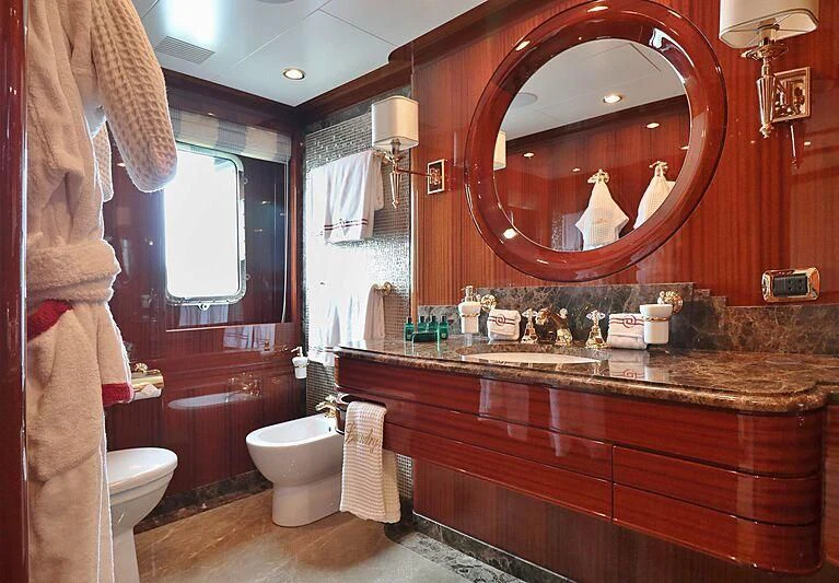 a bathroom with a large mirror aboard FORWIN Yacht for Sale