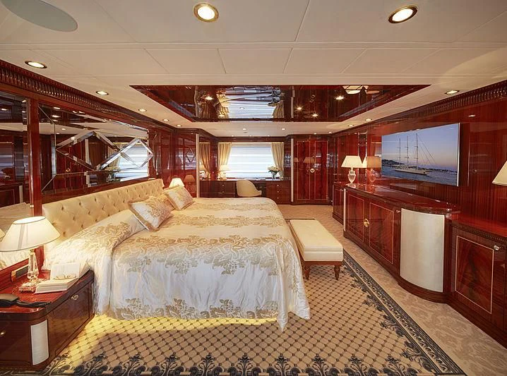a room with a bed and a television aboard FORWIN Yacht for Sale