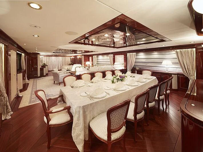 a dining room with tables and chairs aboard FORWIN Yacht for Sale
