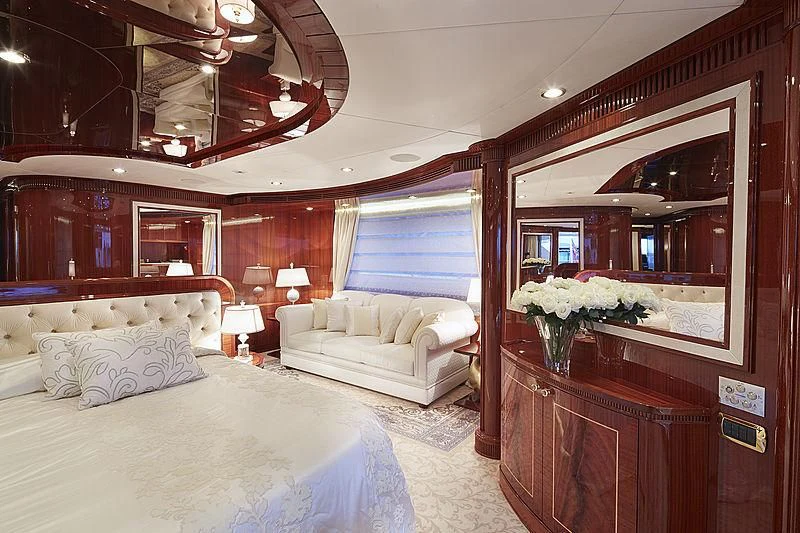 a large bedroom with a large mirror aboard FORWIN Yacht for Sale