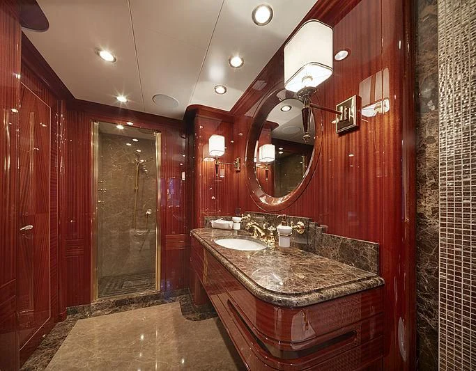 a bathroom with a countertop sink and mirrors aboard FORWIN Yacht for Sale