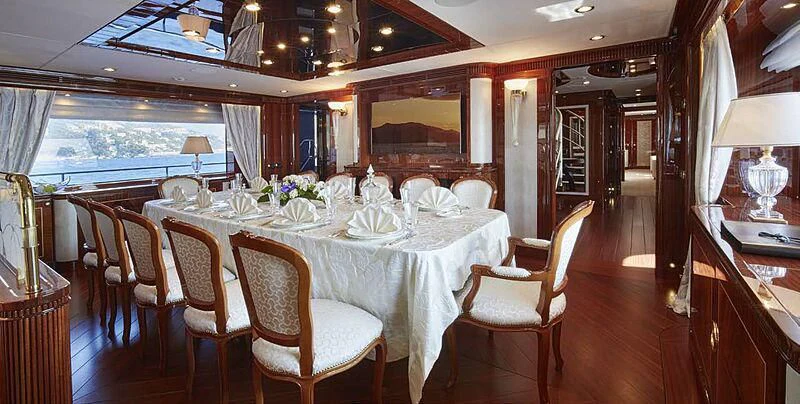 a dining room with a table and chairs aboard FORWIN Yacht for Sale