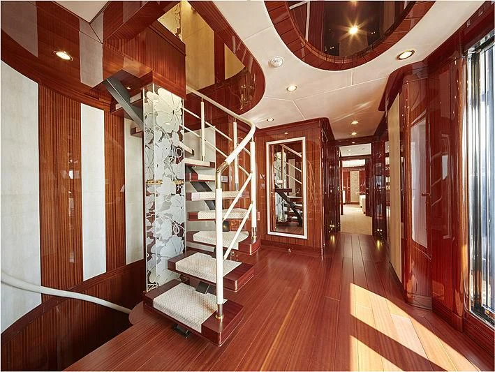 a long hallway with wooden floors aboard FORWIN Yacht for Sale