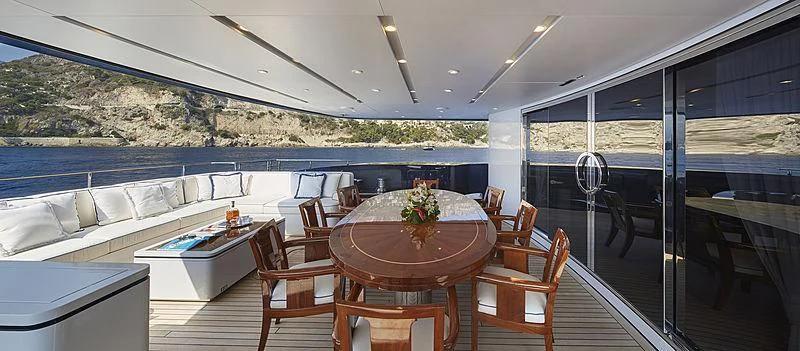 a room with a table and chairs aboard FORWIN Yacht for Sale