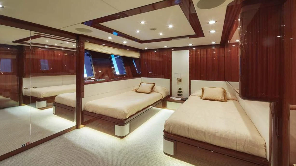 a room with a bed and a desk aboard FORWIN Yacht for Sale