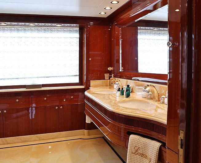 a bathroom with a sink and a mirror aboard FORWIN Yacht for Sale