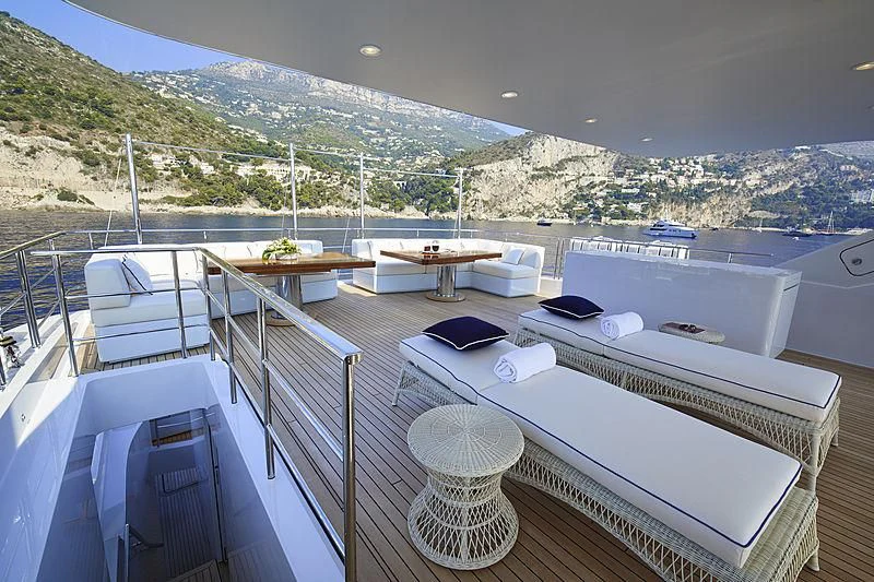 a balcony with a view of a city and mountains aboard FORWIN Yacht for Sale