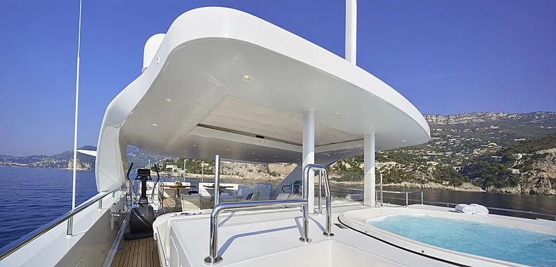 a large white boat on a body of water aboard FORWIN Yacht for Sale