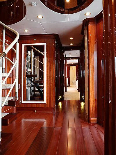 a hallway with wood floors and a glass door aboard FORWIN Yacht for Sale