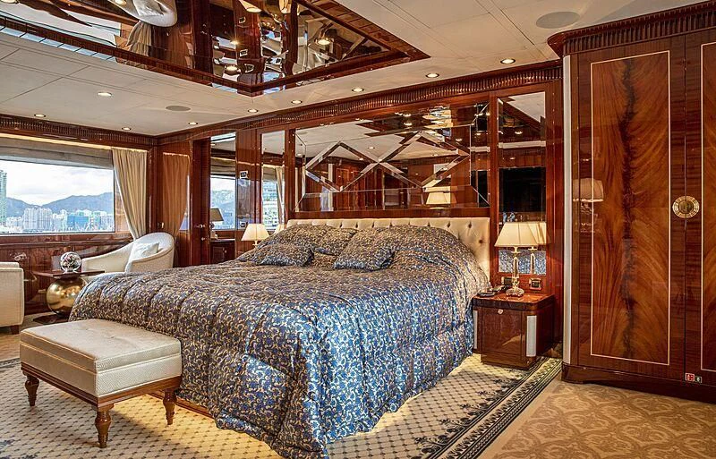 a large bedroom with a large bed aboard FORWIN Yacht for Sale