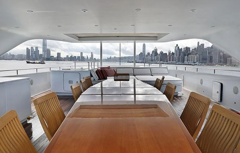 a large room with a table and chairs aboard FORWIN Yacht for Sale