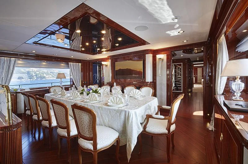 a dining room with a large table aboard FORWIN Yacht for Sale