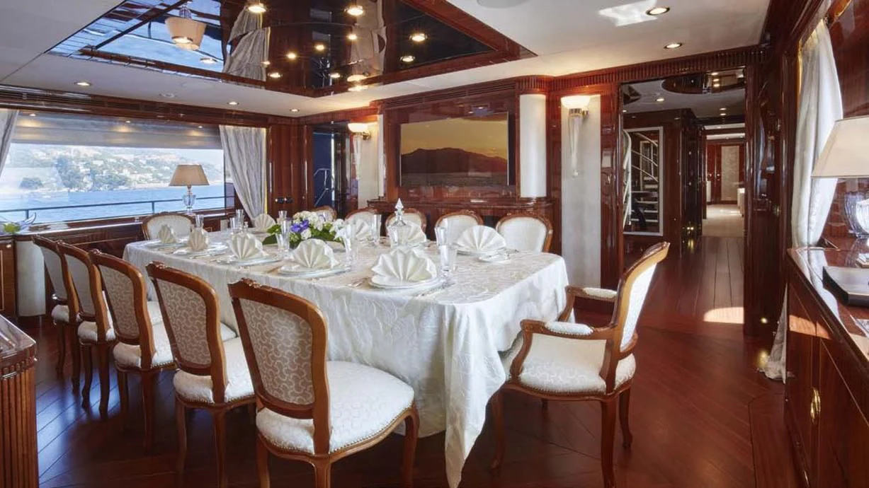 a dining room with tables and chairs aboard FORWIN Yacht for Sale