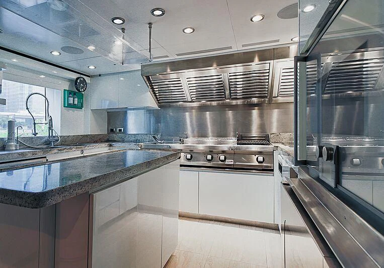 a kitchen with stainless steel appliances aboard FORWIN Yacht for Sale