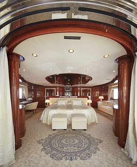 a large room with a bed and a mirror aboard FORWIN Yacht for Sale