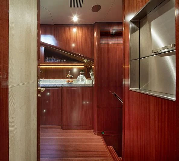 a wood cabinet in a kitchen aboard FORWIN Yacht for Sale