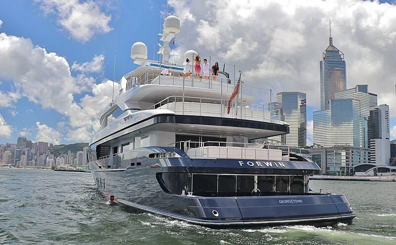 a boat with a large ship on the water aboard FORWIN Yacht for Sale