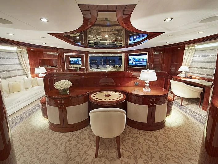 a large room with a piano and a couch aboard FORWIN Yacht for Sale