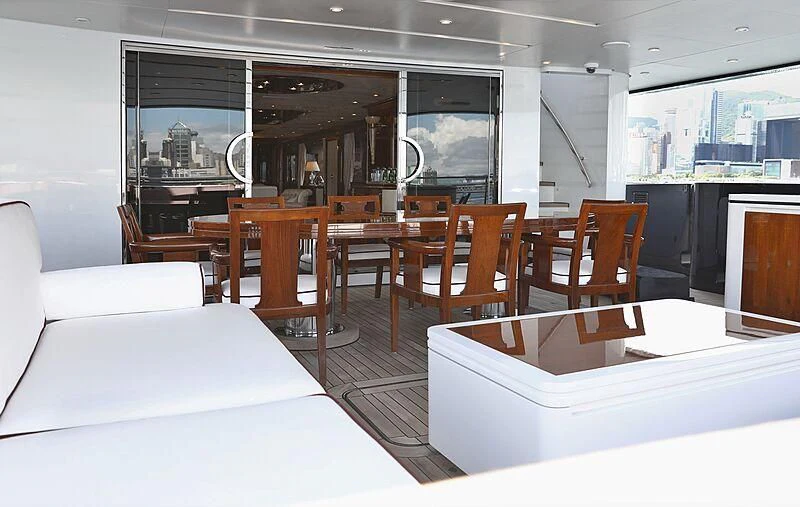 a room with a bed and a table and chairs aboard FORWIN Yacht for Sale