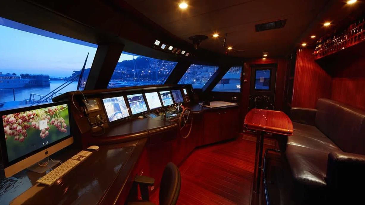 a room with many monitors and a couch aboard FORWIN Yacht for Sale