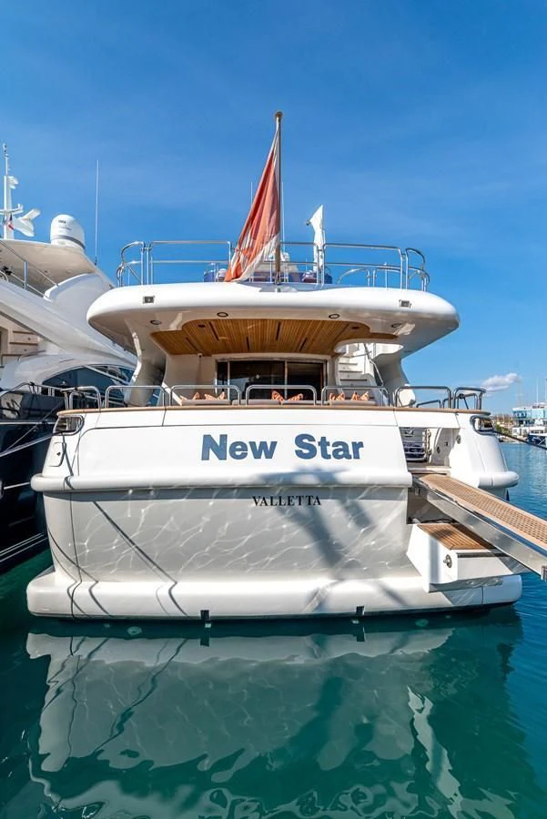 a white boat in the water aboard NEW STAR Yacht for Charter