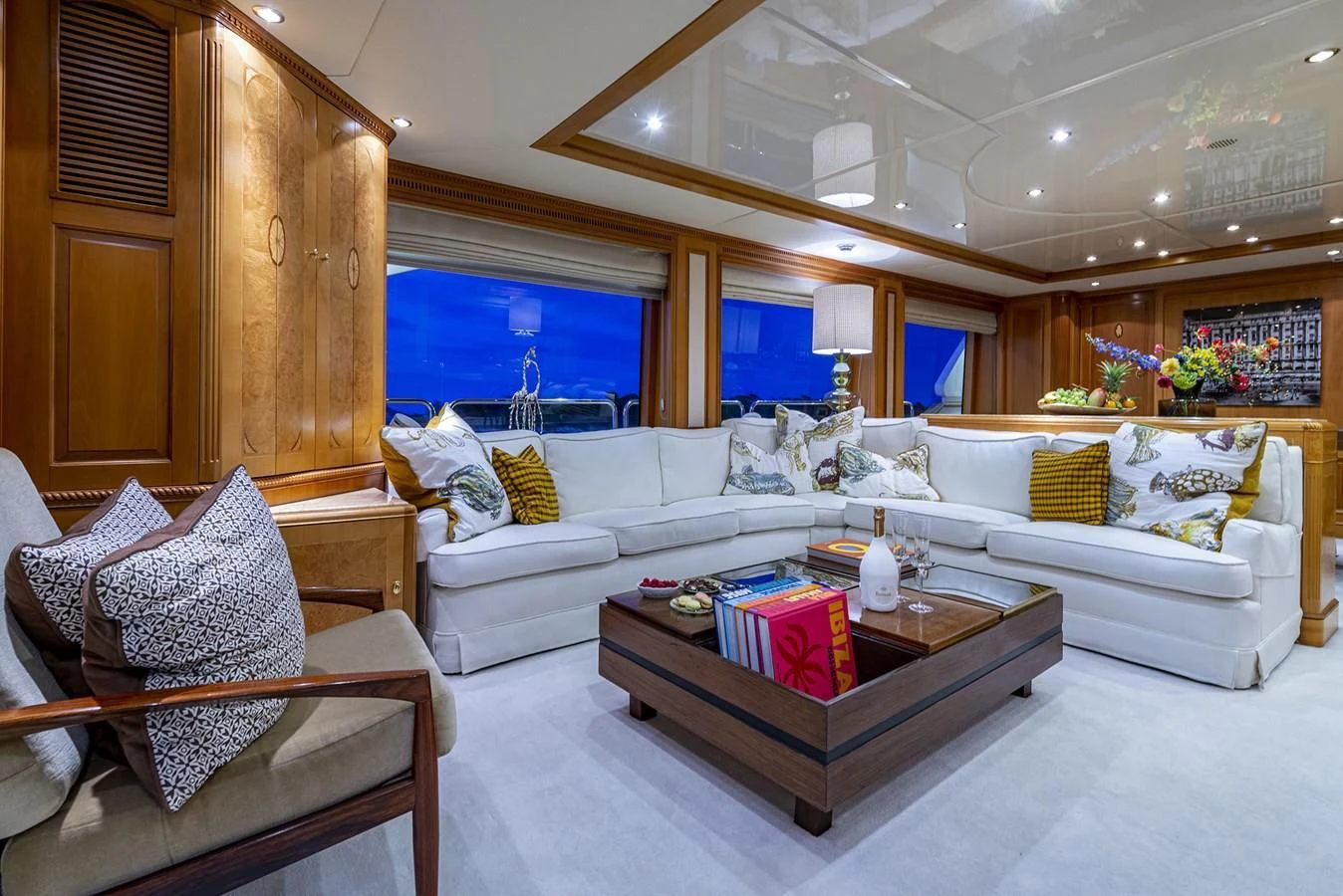 a living room with a couch and a coffee table aboard NEW STAR Yacht for Charter