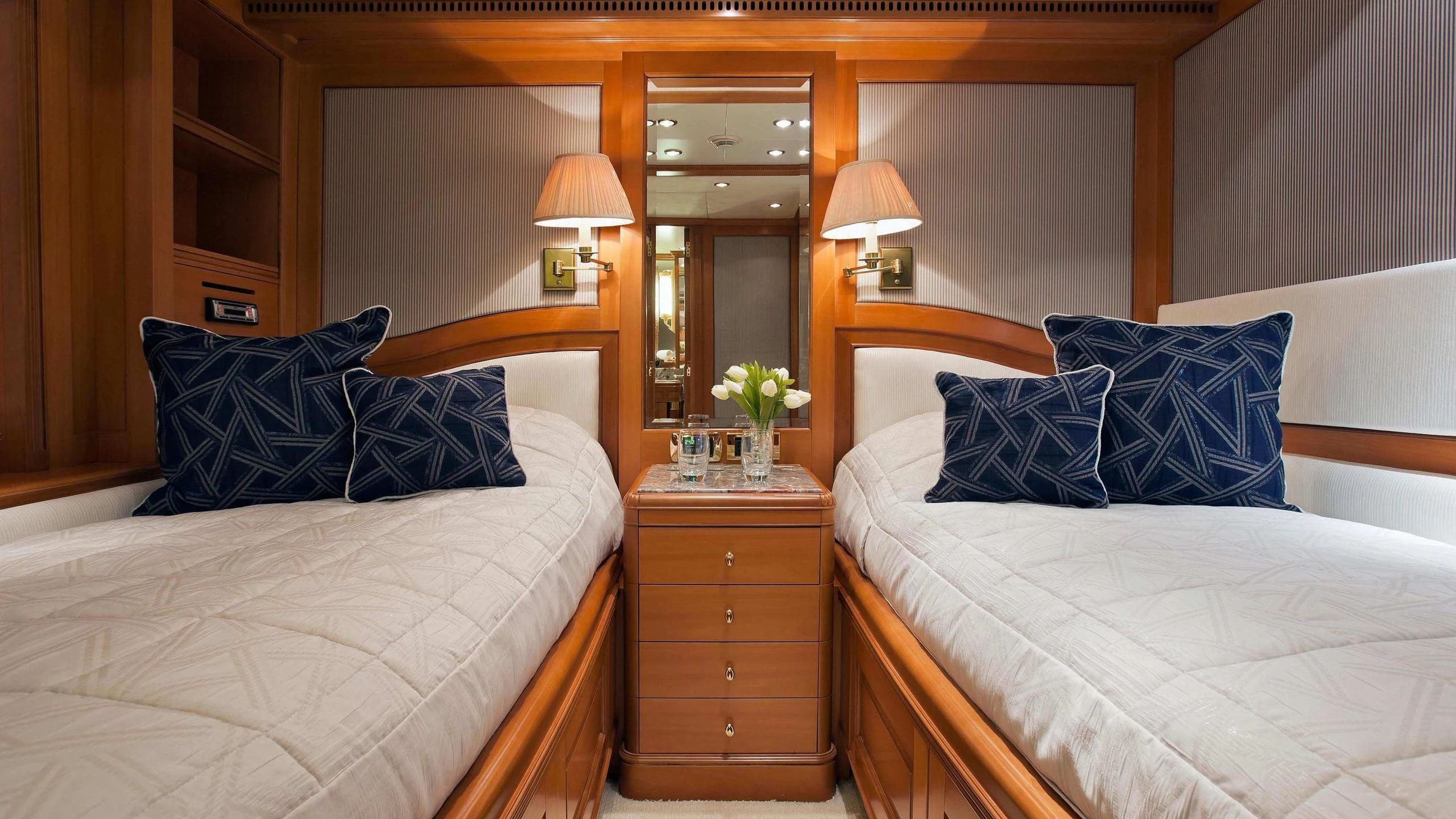 a couple of beds in a hotel room aboard NEW STAR Yacht for Charter