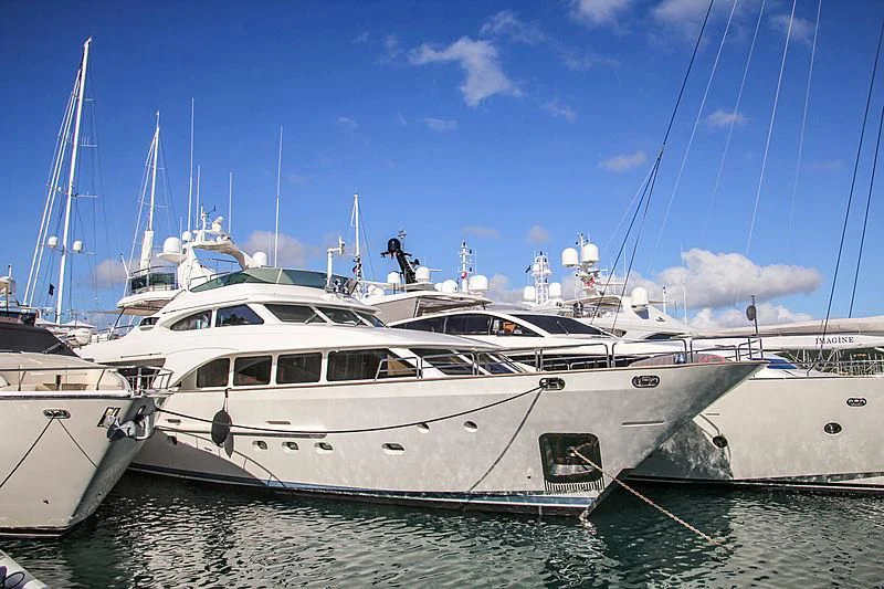 several white yachts in a harbor aboard NEW STAR Yacht for Charter