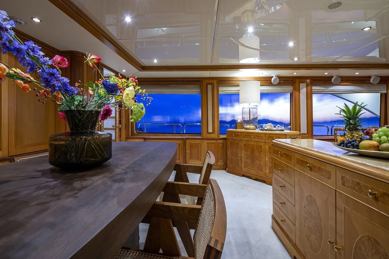 a kitchen with a table and chairs aboard NEW STAR Yacht for Charter