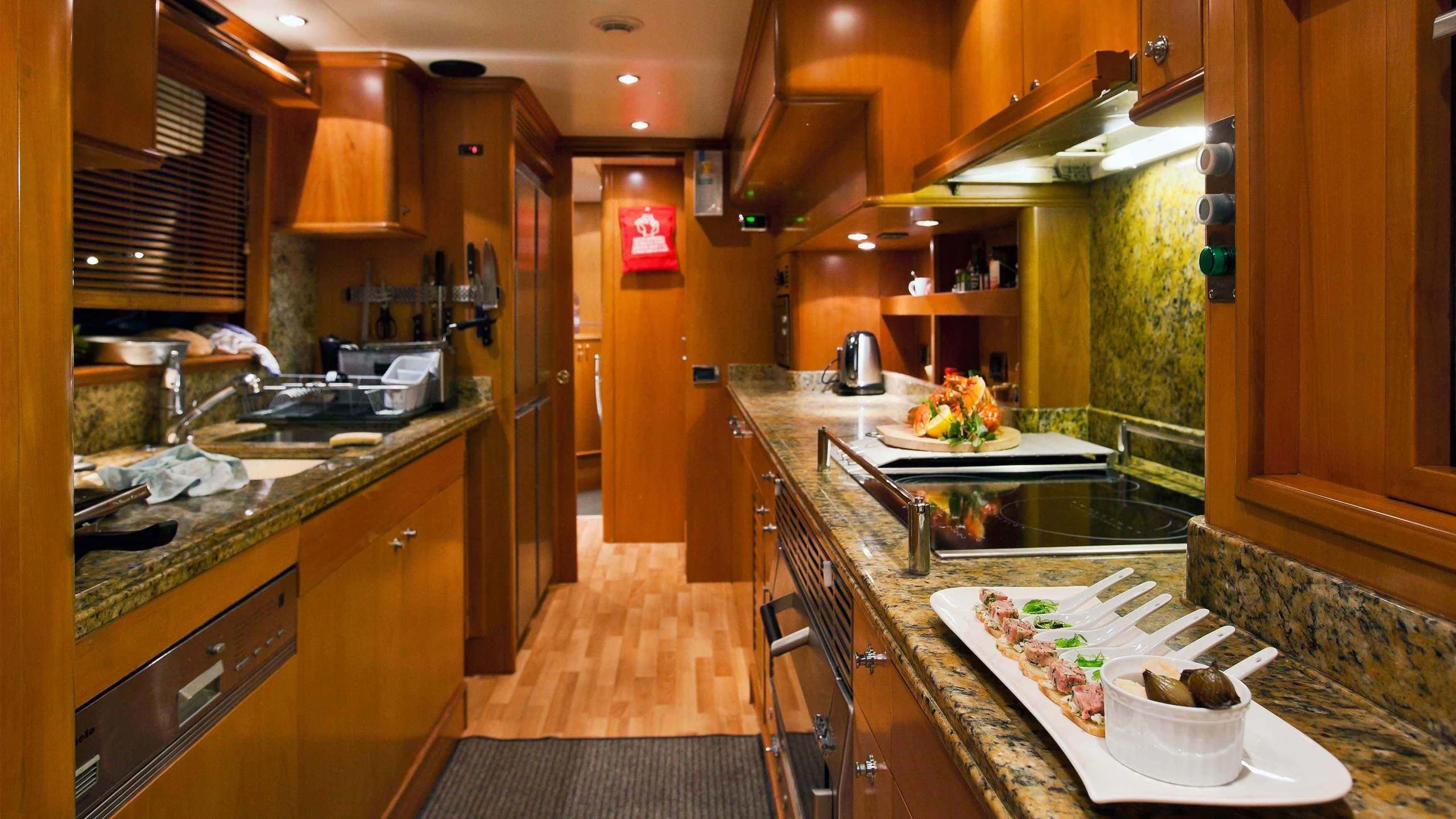 a kitchen with a large island aboard NEW STAR Yacht for Charter